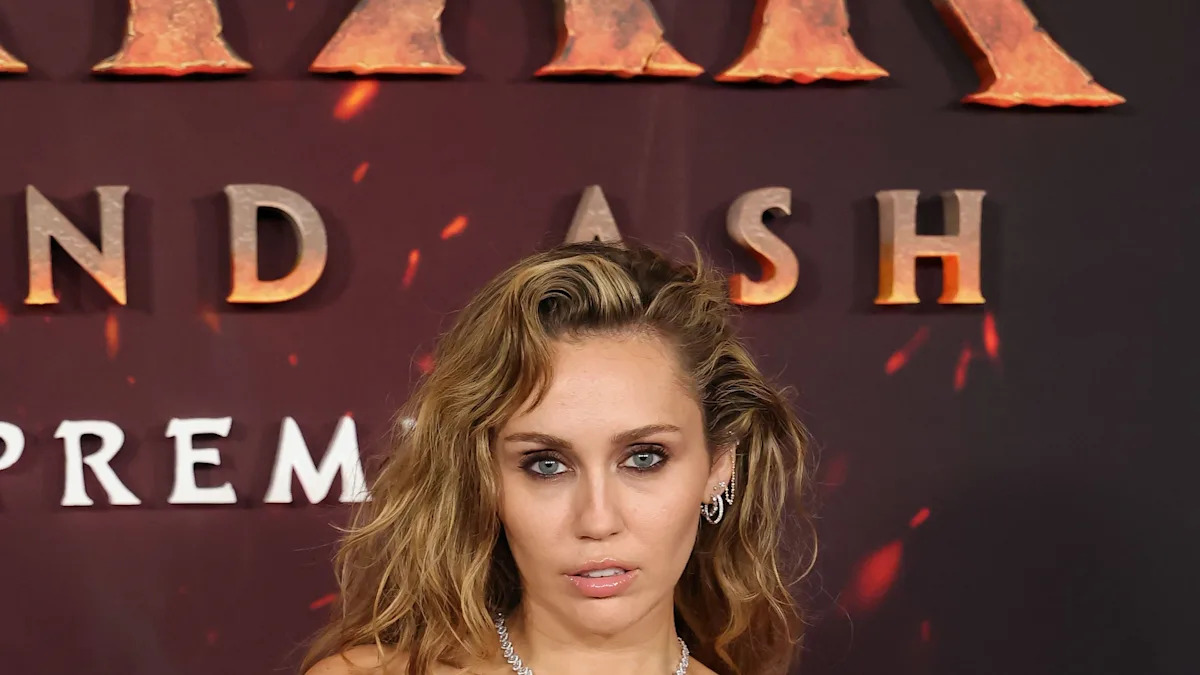 Close-up of Miley Cyrus's custom Jacquie Aiche cushion-cut diamond engagement ring.