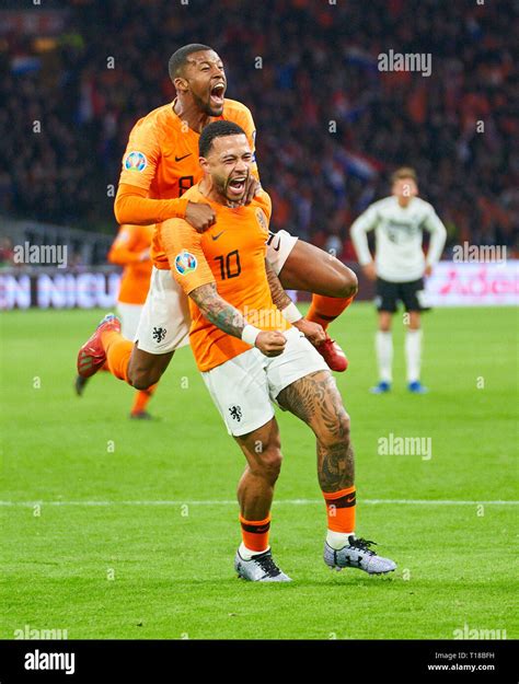 Memphis Depay celebrates his brilliant solo goal against Lithuania.