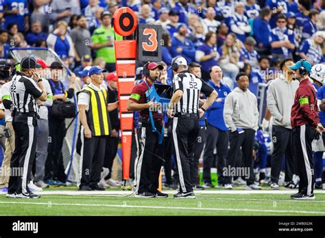NFL security personnel reviewing footage of the McCarthy-Hutchinson incident.
