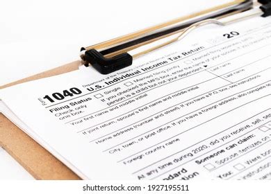 Taxpayer reviewing state tax form with new add-back requirements for federally exempt income.