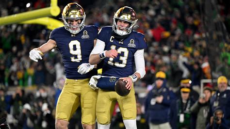 Fighting Irish players celebrate after breaking the modern-era scoring record.