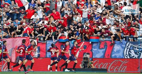Osasuna fans prepare a special mosaic display to show their support during the match against Real Sociedad.