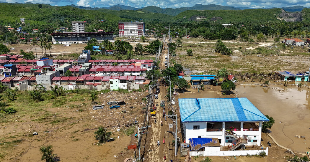 Evacuees take shelter in a repurposed basketball court in Isabela province.