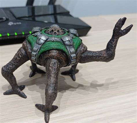 The alien Rocky demonstrating communication through a creative puppet show.