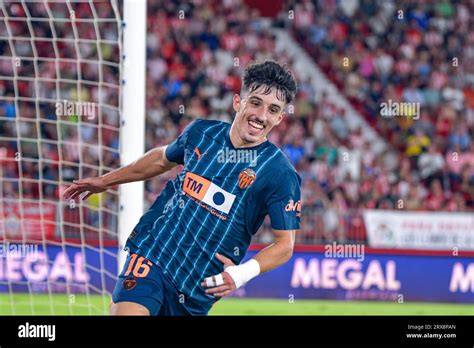 Diego López celebrates his equalizing goal for Valencia.