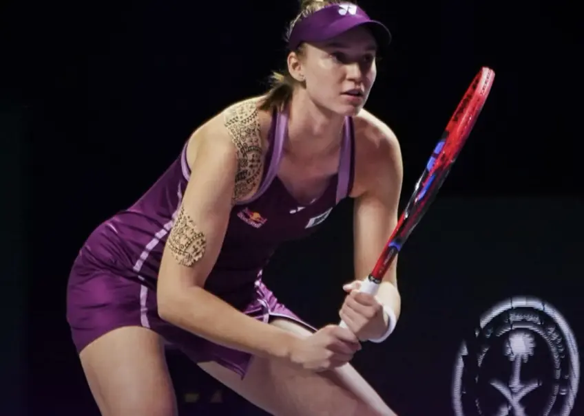 Rybakina reacts after securing her place in the championship match.