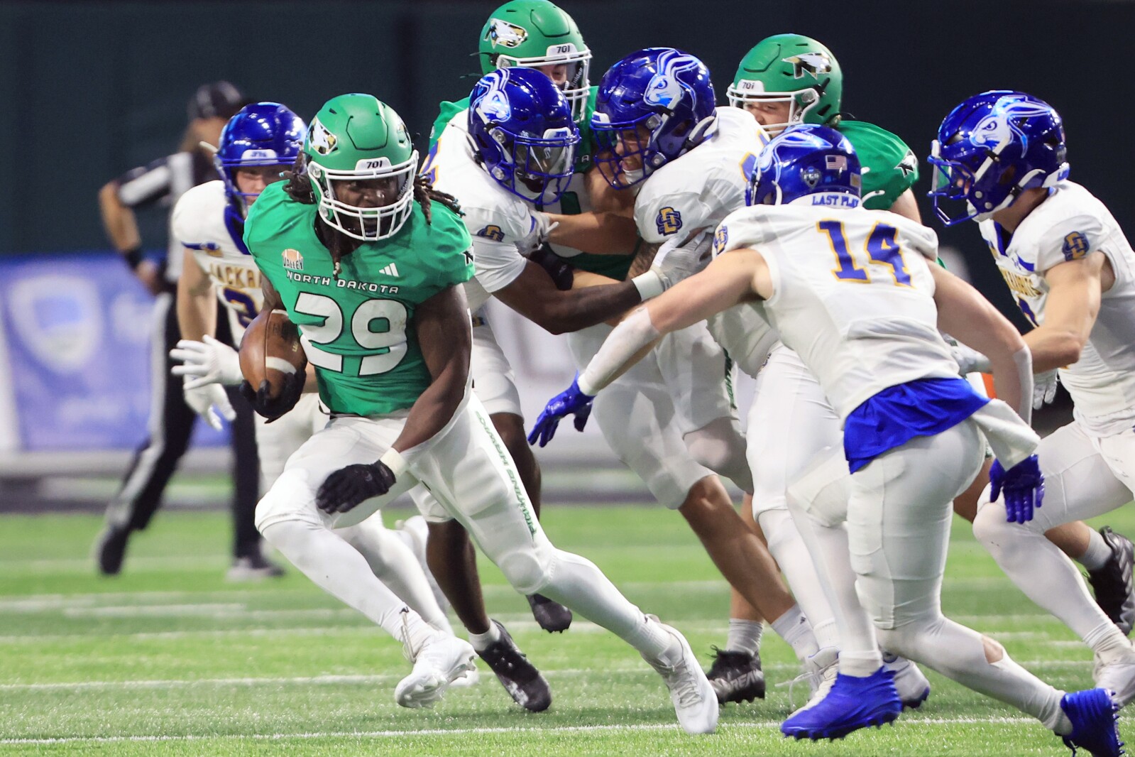Energetic atmosphere at the Alerus Center as fans cheer during the SDSU vs UND showdown.
