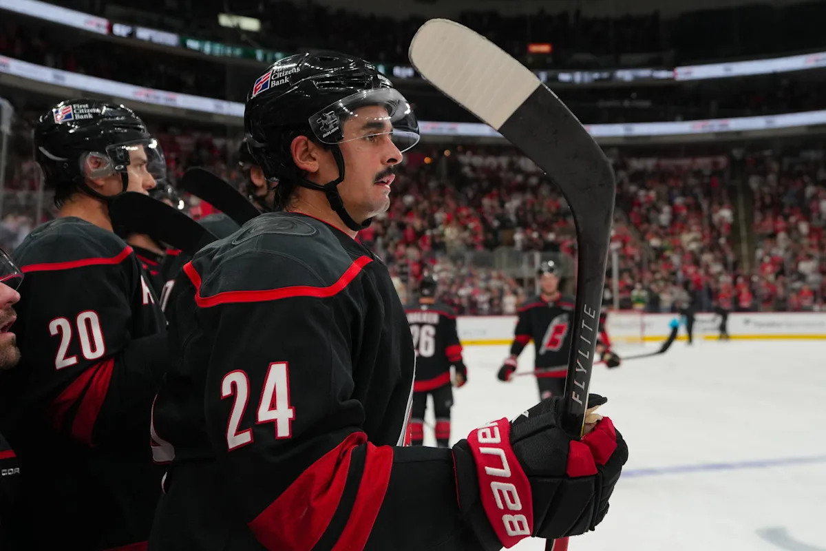 Jarvis goes down after being struck by a high stick from teammate Andrei Svechnikov.