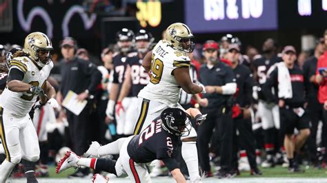 Shy Tuttle unleashes his iconic stiff-arm on Matt Ryan during the 2019 Thanksgiving game interception return.