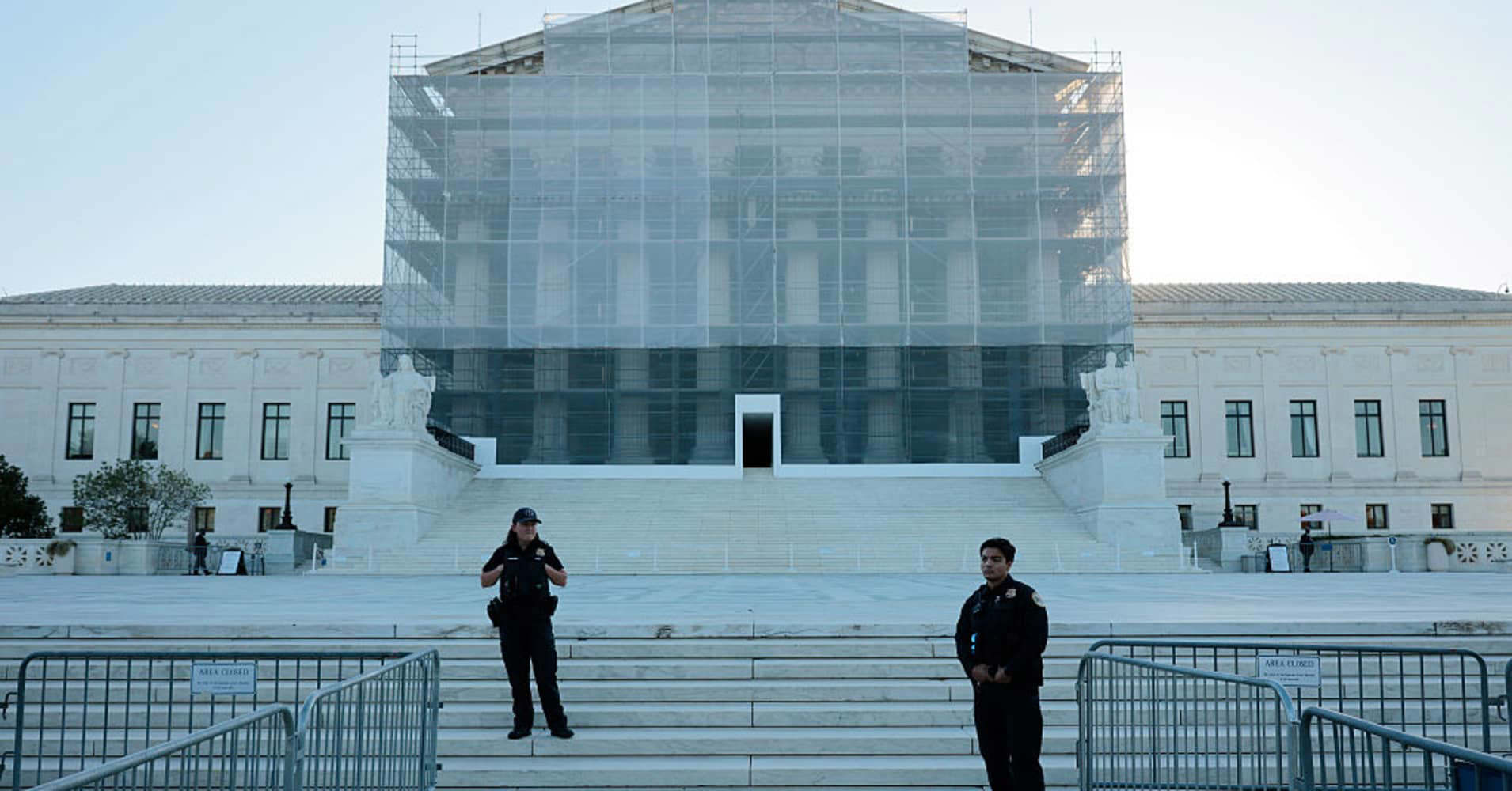 Justices listen during oral arguments on the Trump tariff case at the Supreme Court.