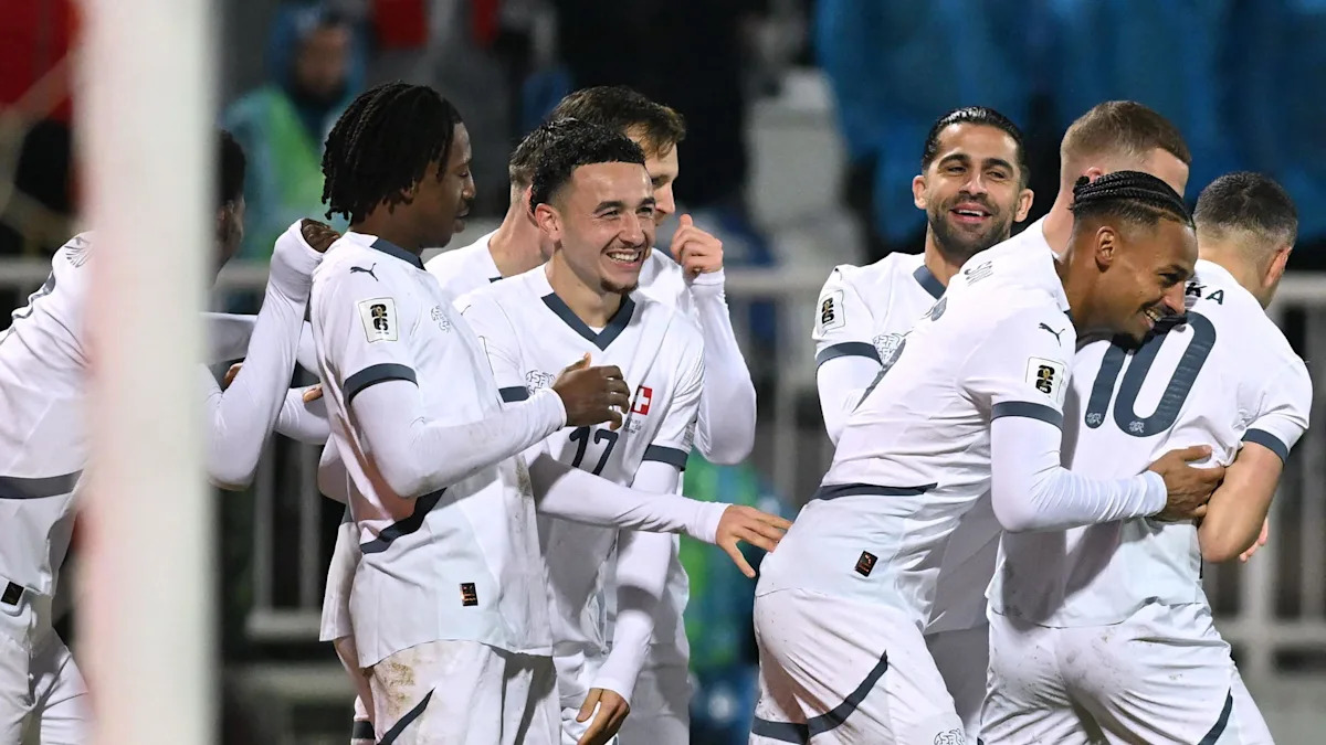 Switzerland players celebrate securing their spot in the 2026 FIFA World Cup.