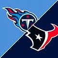 Players and coaches on the sideline during Texans-Titans matchup