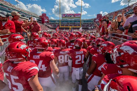 Arkansas Razorbacks huddle together during a timeout against Texas.