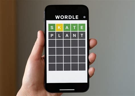 A player celebrating a successful Wordle guess with color-coded feedback