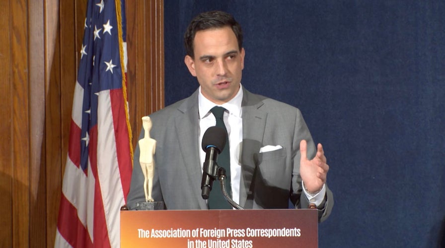 Trey Yingst delivers his acceptance speech at the 2025 Foreign Press Awards.