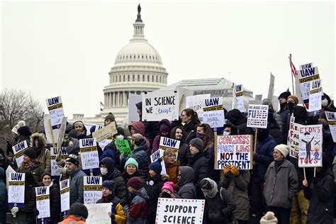 Advocates rallying outside the Capitol to protect education funding.