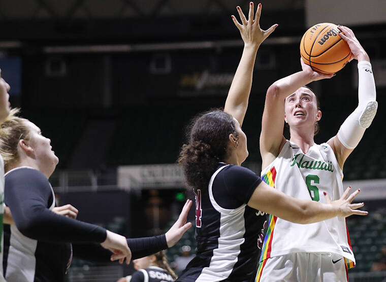 Hawaii's Bailey Flavell drives to the basket during the game against UC Davis.