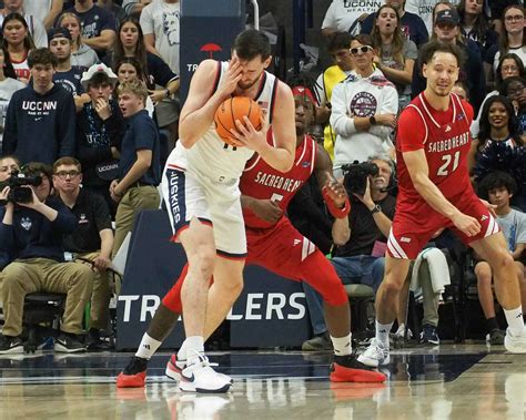 Veteran leaders Ball and Karaban energize the Huskies during their dominant performance.