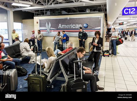 Travelers exit the diverted United Airlines flight at St. Louis Lambert International Airport.