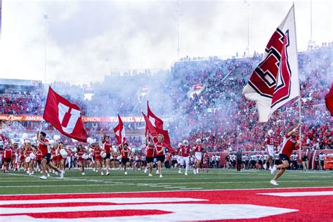 Utes run onto the field during pregame festivities