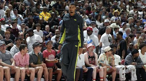 Spurs medical staff assist Wembanyama after the injury occurred in the third quarter.