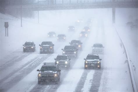 A vehicle navigating through heavy snow in Minnesota.