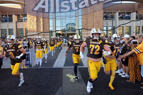 The Wyoming Cowboys football team in War Memorial Stadium during a game